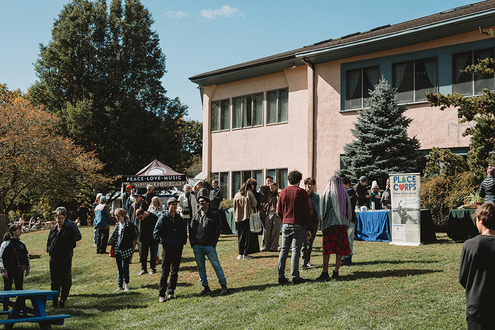 Crowd gathered behind the main school building during the Fall 2022 Roots to Renewal celebration of Hawthorne Valley's 50th anniversary